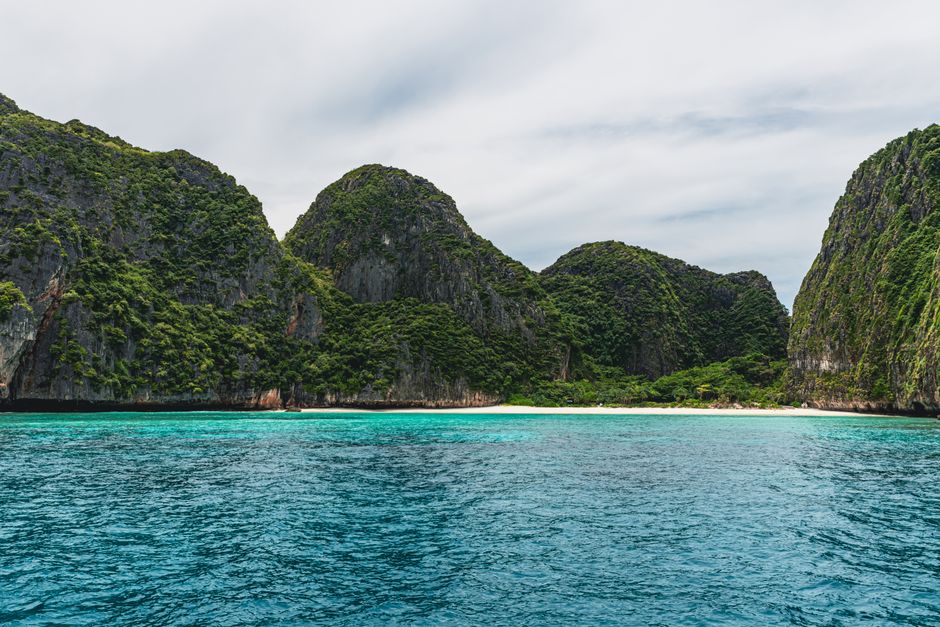 Beautiful turquoise waters and limestone cliffs in Phuket, Thailand.