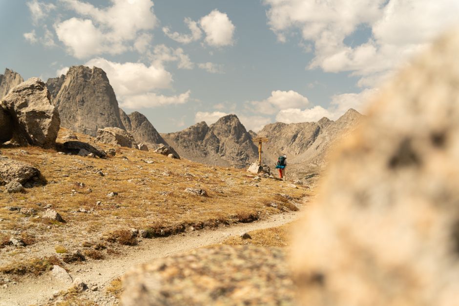 Explore the stunning landscapes of Wyoming's Wind River Range on a sunny hiking day.